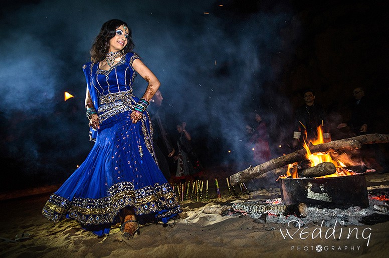 Bride dances by fire